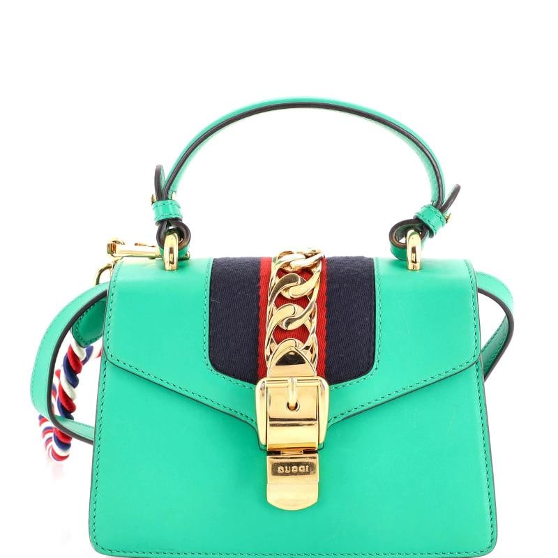 Gucci Sylvie Top Handle Bag Leather Mini: Accessories: Extra Strap, With Strap Measurements: Handle Drop 3.5", Height 5.5", Width 8", Depth 3", Strap Drop 19-21". Condition: Pre-owned - Good,Brand: Gucci,Exterior Material: Leather,Style: Top