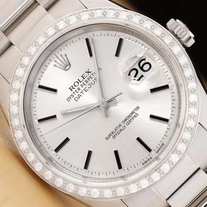 ROLEX DATEJUST 1601 18K WHITE GOLD STEEL SILVER DIAL DIAMOND OYSTER BAND WATCH: This is an authentic Rolex Datejust 1601 watch with Rolex stick dial Ref., custom 18K white gold diamond bezel, and custom stainless steel oyster bracelet. Descriptions: Brand: Rolex Model: Datejust