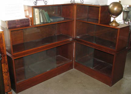 FRENCH ART DECO BURL WOOD CORNER BOOKCASE CABINET: Deco corner burl wood bookcase comprised of six glass-fronted shelves in four stair-stepped sections. 42" h x 44" w x 14" d; return 56"w (Acquired from Boo Radley's European Antique Imports, Los