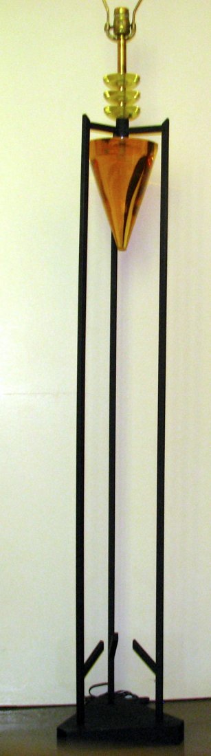 MID-CENTURY VAN TEAL LUCITE AND METAL FLOOR LAMP: Three chartreuse discs above a suspended amber Lucite cone, square powder coated base with four upward accents on the inside bottom. 65" h to top of harp, 7" w, The black frame is approximately 7" x 7