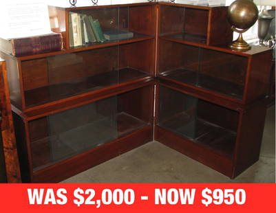 FRENCH ART DECO BURL WOOD CORNER BOOKCASE CABINET: Deco corner burl wood bookcase comprised of six glass-fronted shelves in four stair-stepped sections. 42" h x 44" w x 14" d; return 56"w (Acquired from Boo Radley's European Antique Imports, Los