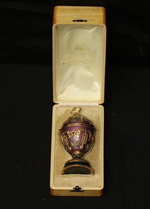 Henrik Wigstrom Faberge egg with double headed eagle: Henrik Wigstrom (1862-1923) Faberge egg with double headed eagle finial, diamonds and precious stones placed throughout possibly ruby. Interior of lid covered in velvet with rabbit resting in center, 