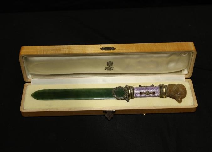Henrik Wigstrom (1862-1923) Faberge letter opener: Henrik Wigstrom (1862-1923) Faberge letter opener, with enameled handle, nephrite jade blade, gilt decoration and ruby style stone inserts, marked "H.W." "88" and with the Faberge mark, in original Fa