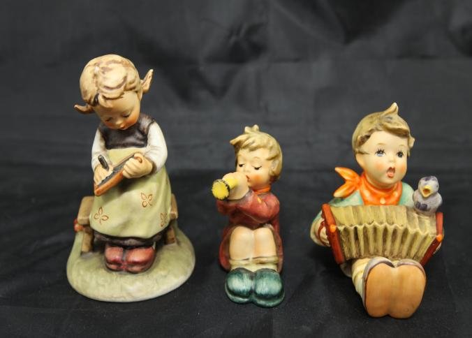 Goebel TMK-4 hummels: Busy student, Lets sing, Girl: Three Goebel TMK-4 hummels incl Busy student #367, Lets sing #110/0, Girl with trumpet # 391, largest being 4"T.