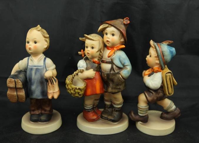 Three Goebel TMK-5 hummels incl Boots, Surprise, School: Three Goebel TMK-5 hummels incl Boots #143/0, "Surprise" #94/I, "School Boy" #82 2/0, tallest being 5.25"T.