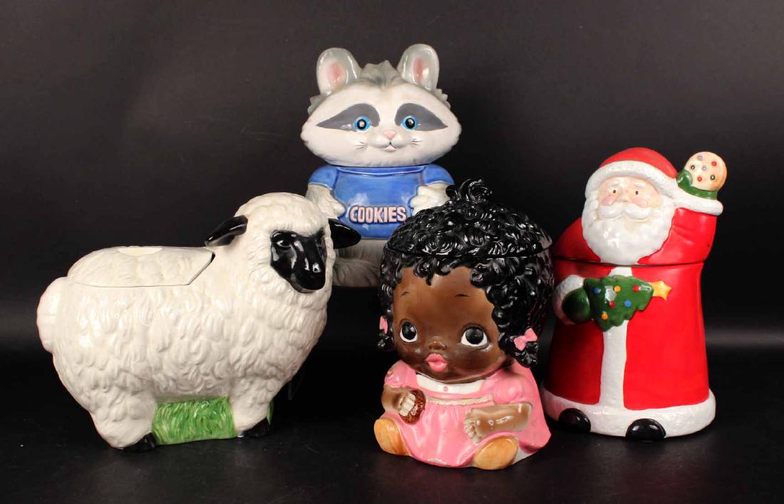 Four Ceramic Cookie Jars: Depicting a Sheep, Santa Claus, Raccoon and a Black Americana Little Girl. Tallest 12"h. Provenance: Property of a New Jersey Collector.