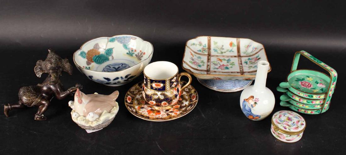 Assorted Group of Decorative Articles: Including a bronze Thai elephant, cloisonne coasters, Lladro porcelain chicken figure box, Davenport porcelain cup and saucer, Limoges porcelain pill box and two Chinese porcelain small bowls.