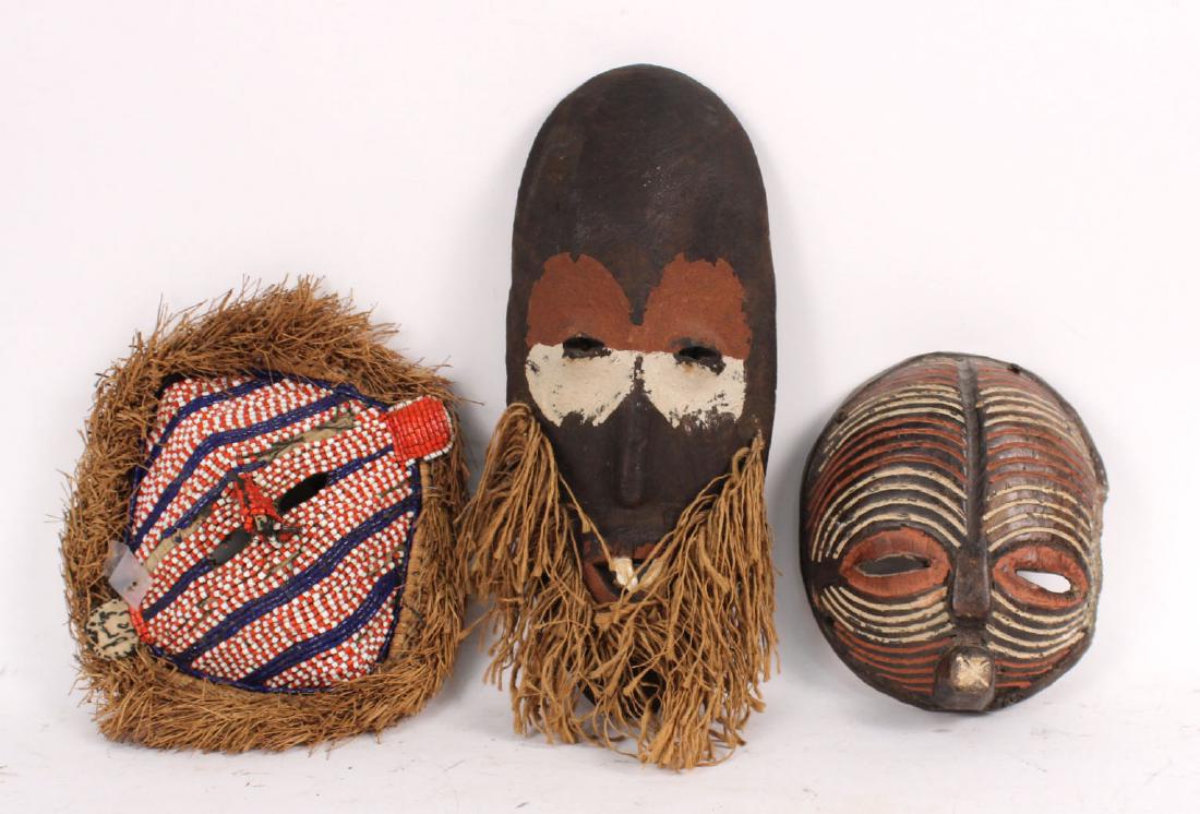 THREE AFRICAN TRIBAL MASKS (1 of 7)