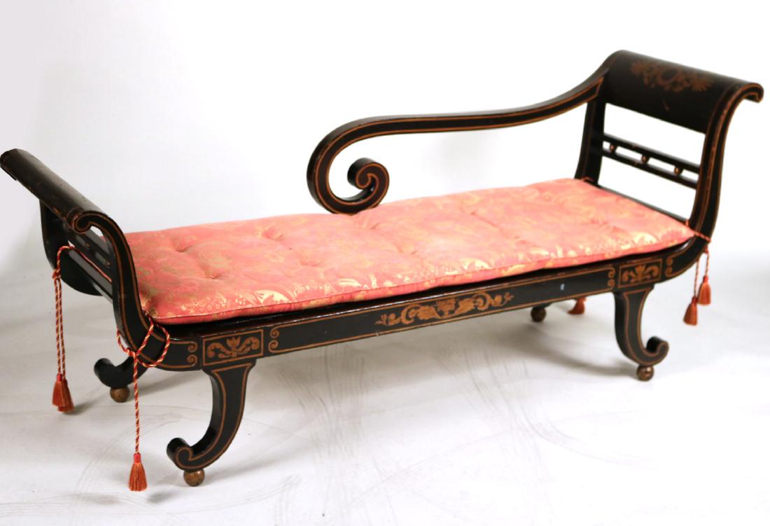 Federal Gilt-&-Black Painted Caned Seat Recamier: American, c. 1815, having cured ends, a scroll arm, and scroll feet on giltwood balls, stenciled with classical decoration, custom made cushion. 33"h x 6'4"l x 22"w Provenance: Purchased from Sotheby'