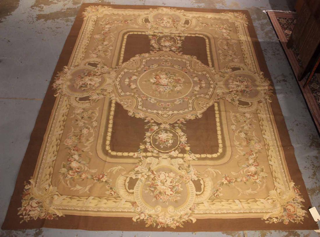 Aubusson Style Carpet: Worked in tones of brown, pink, green, and beige. 11'7"l x 9'w
