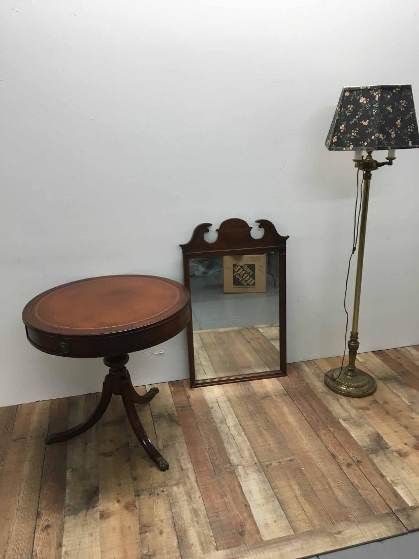 LEATHER TOP DRUM TABLE: Leather top drum table. Together with a mirror and floor lamp.