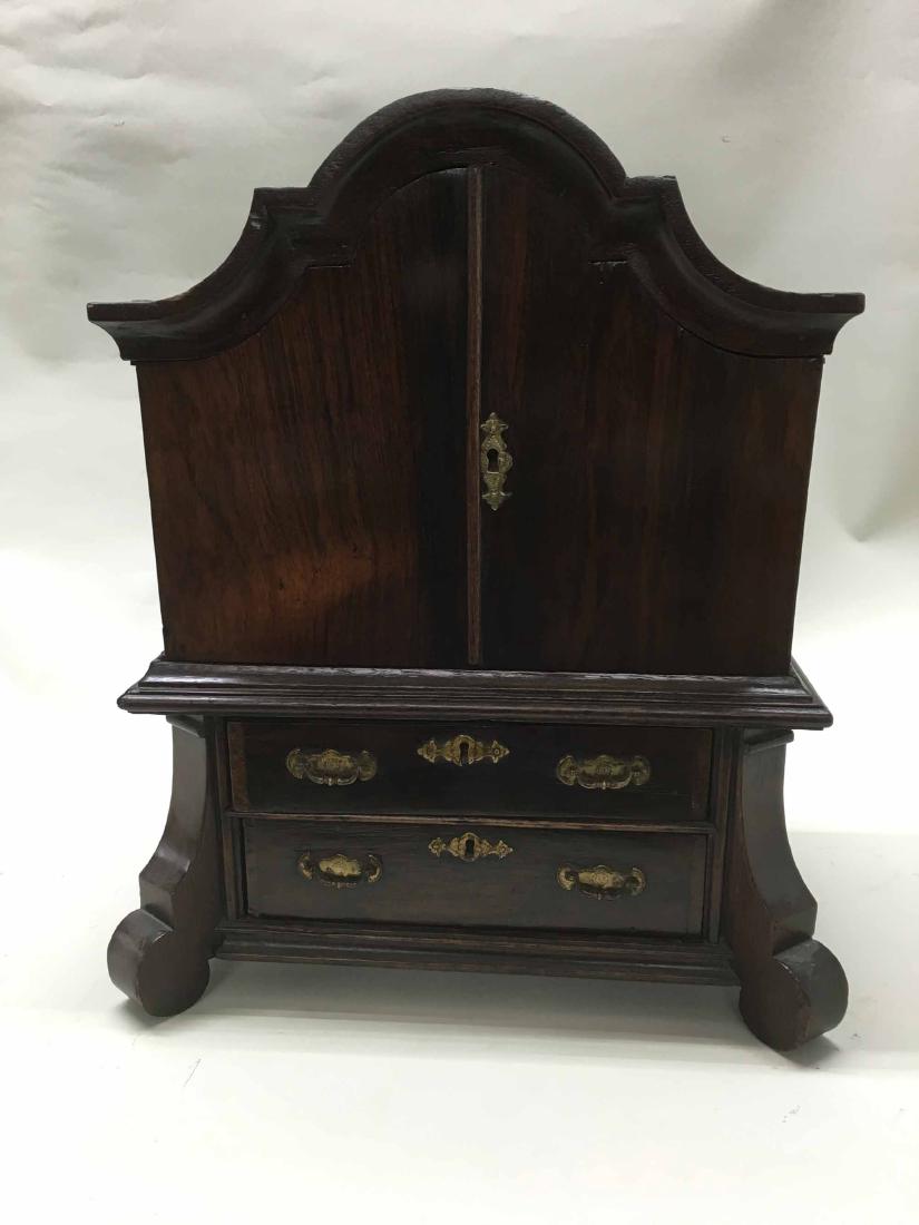 BONNET TOP DIMINUTIVE CABINET: Bonnet top dark stained diminutive cabinet. 21 1/2" tall x 17"wide x 11" deep