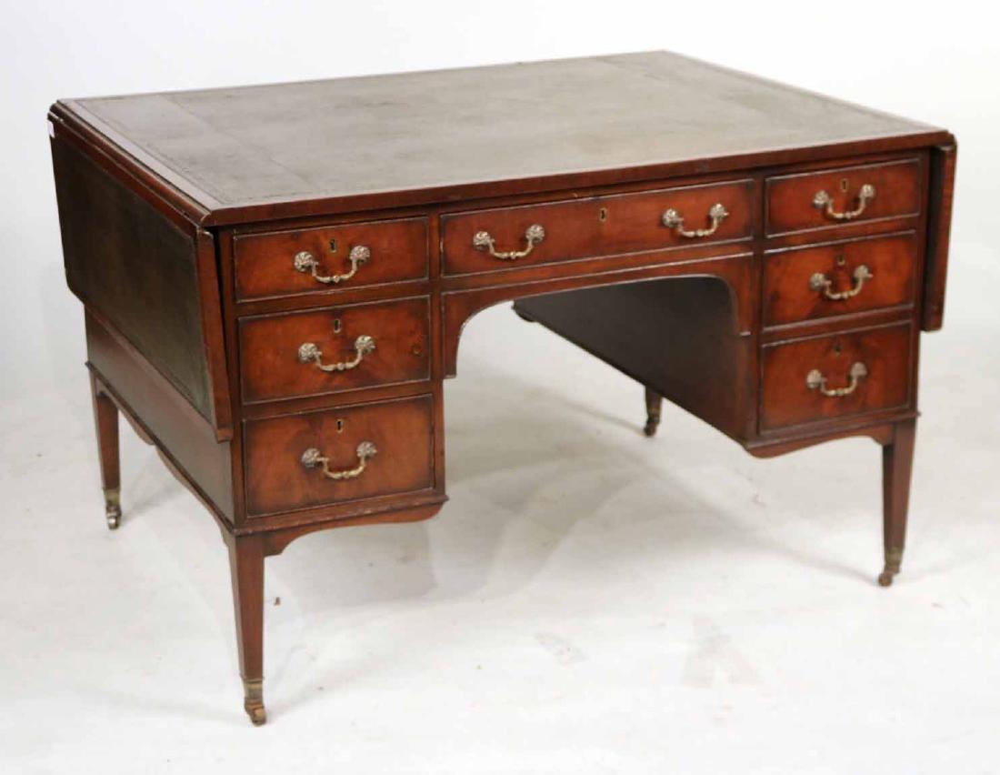 George III Mahogany Leather-Inset Partner's Desk: English, late 18th C., with drop leaves on either side. 30-3/4"h x 48-1/2"w x 36-1/2"d, leaves down