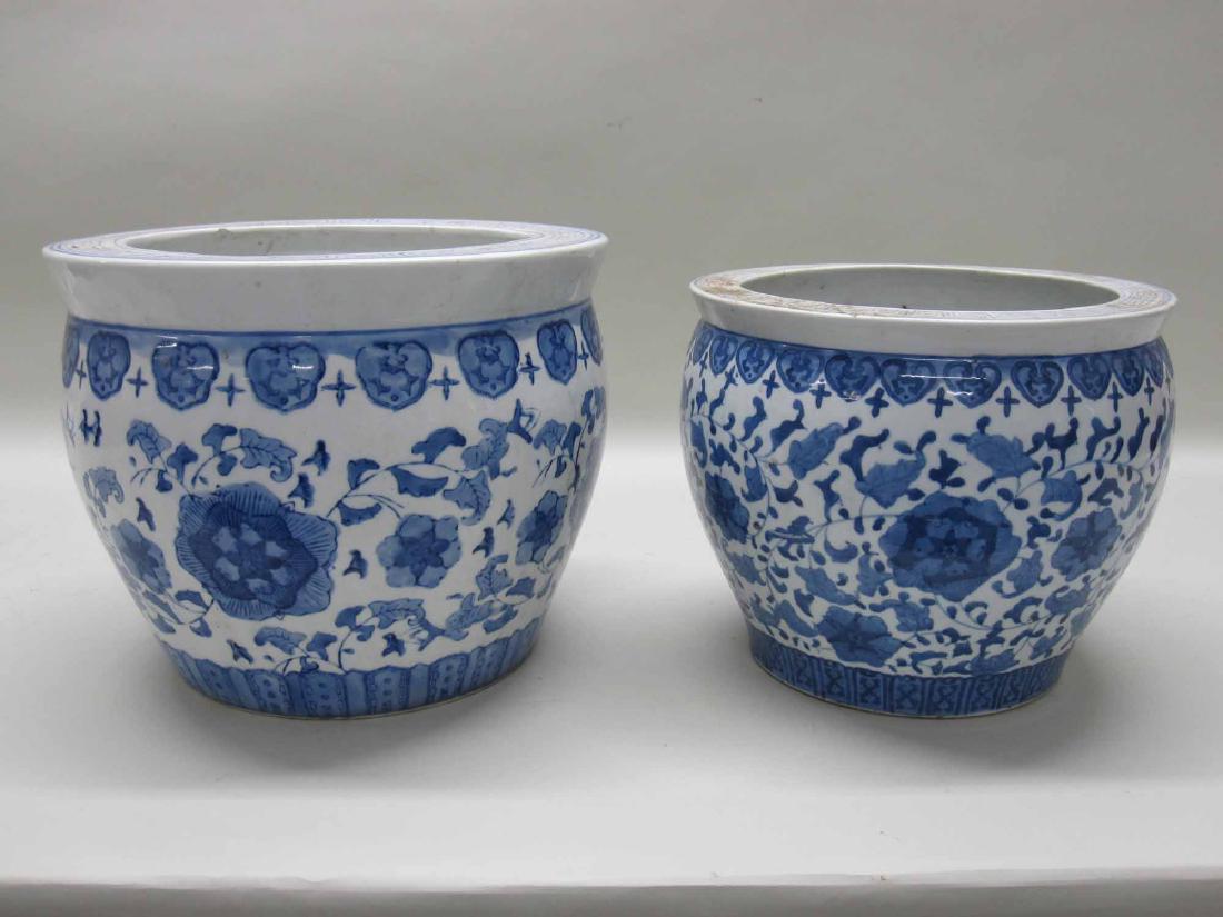 TWO CHINESE BLUE AND WHITE PORCELAIN CACHE POTS (1 of 4)