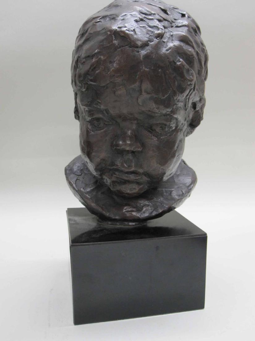 PATINATED METAL BUST OF A CHILD (1 of 4)
