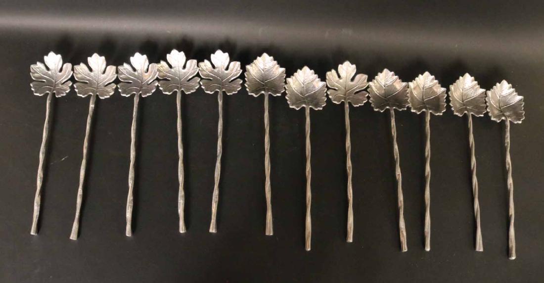 Set of Twelve Metal Leaf Form Servers: Silvered metal long twig and leaf form serving utensils. Each 15"l. Property from the Collection of Phillips Hathaway, Ragamont House, Salisbury, CT.