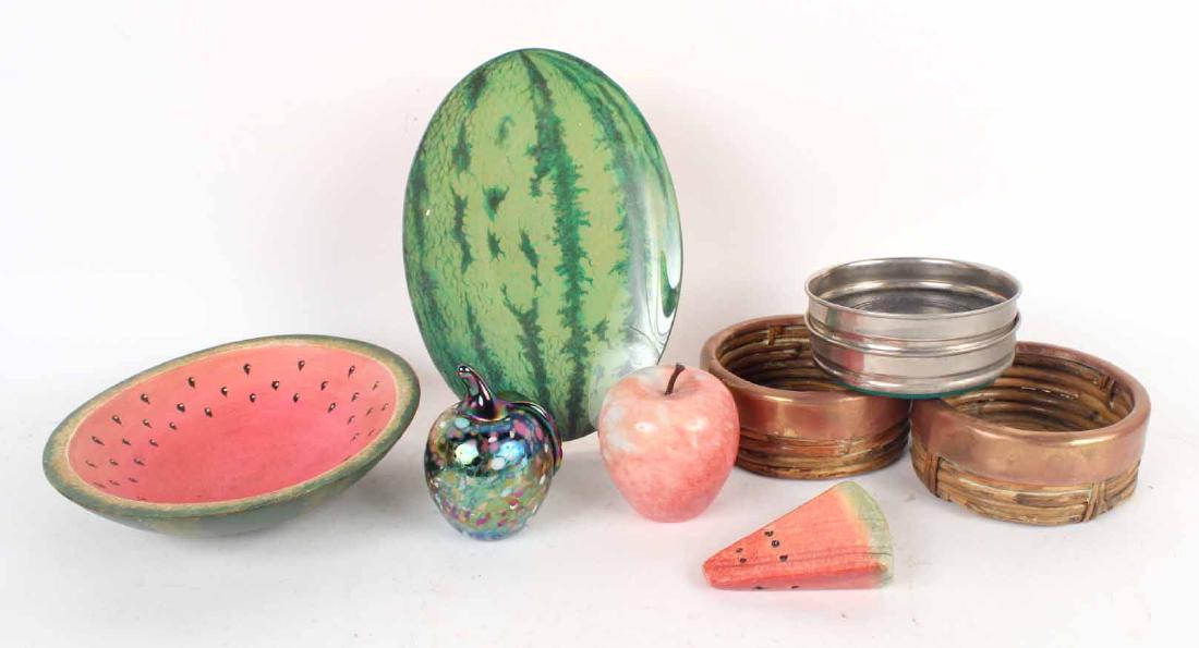 Group of Fruit Table Articles: Comprising, a John Derian watermelon plate, a painted wood watermelon bowl, a stone watermelon slice, an art glass apple, a hardstone apple. Together with a pair of white-metal wine coasters and a pai