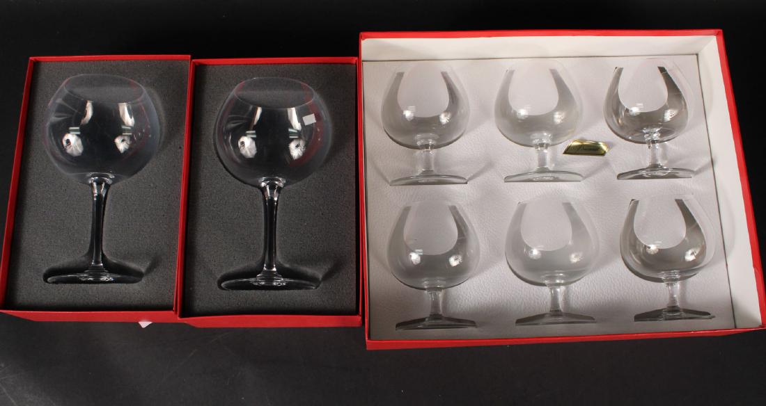Three Boxed Sets of Baccarat Glasses: Comprising, a boxed set of six brandy snifters, and two boxed wine glasses. 4-3/4"h and 7-1/2"h
