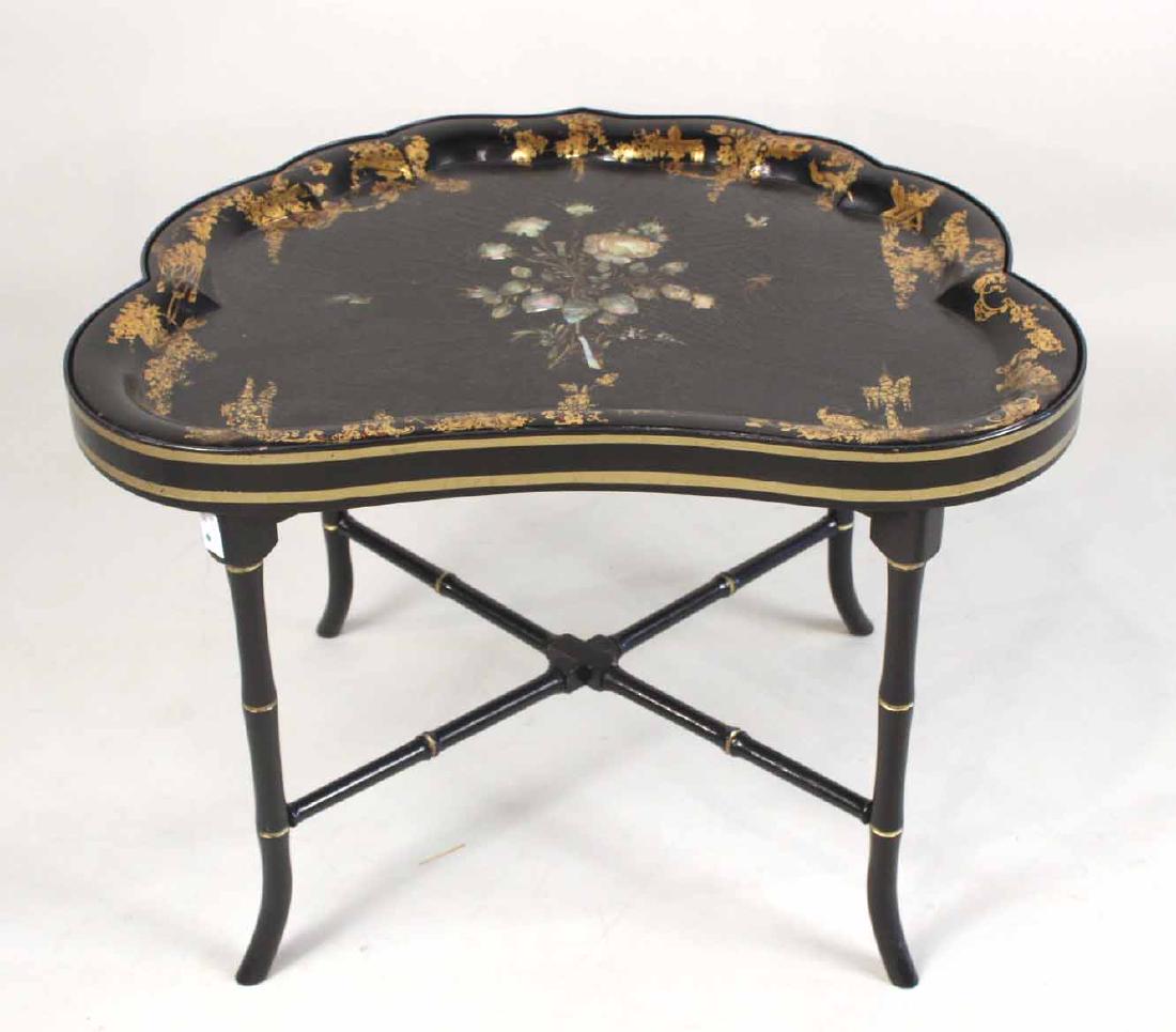 Regency Parcel-Gilt & Mother-of-Pearl Inlaid Tray: English, c. 1830, the tray with cartouche shape, with foliate decoration, on a later conforming stand on faux-bamboo legs joined by stretchers. 21"h x 31-3/4"w x 25-1/2"d