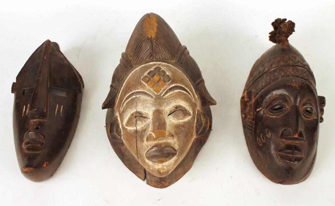 Three Carved Wood African Masks (1 of 9)