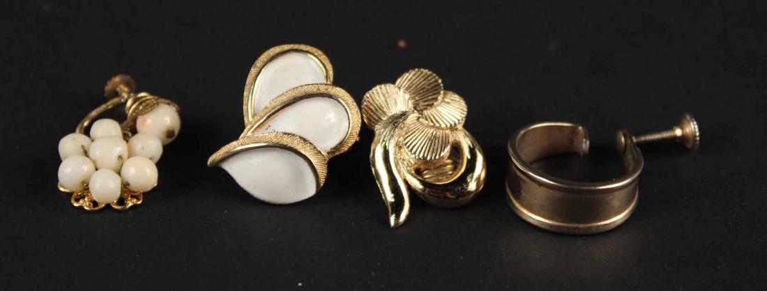 TWO SINGLE COSTUME EAR CLIPS: One stamped Monet, one Trifari, together with two costume screw back earrings. Largest, 7/8"l Property from the Collection of Dr. Arthur and Hope S. Miller.