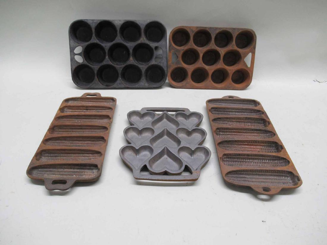 FIVE IRON CORN BREAD AND CAKE MOLDS: 11"l