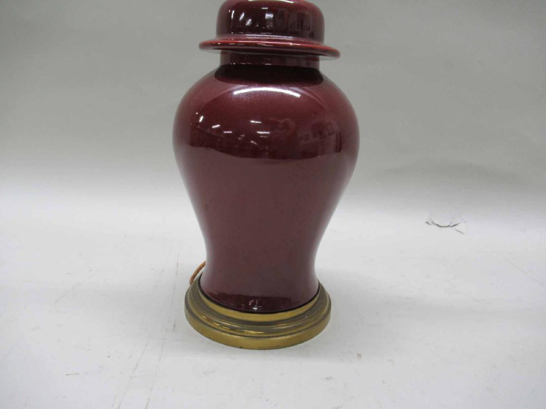 OX BLOOD TABLE LAMP: Covered urn in form. 21 1/2" tall x 6" diameter