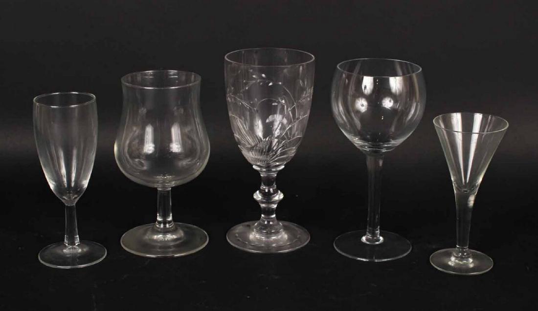 Group of Assorted Glass Stemware: 20th C. Comprising 9 brandy snifters, 6 wine glasses, 2 sherry glasses, 5 etched glass goblets, and 12 flutes. 34 pieces Tallest: 7"h