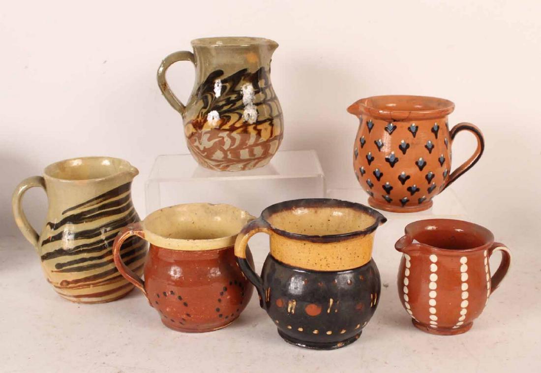 Six Slip-Decorated Redware Pitchers (1 of 4)