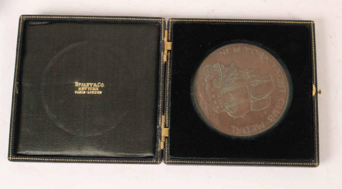 Bronze Medallion Yacht Trophy: In Tiffany original green silk and green velvet leather fitted case, medallion with engraved inscription "New York Yacht Club Medal, Navy Challenge Cup For Sloops Was Won By Nepsi August 9th, 1910. 2-