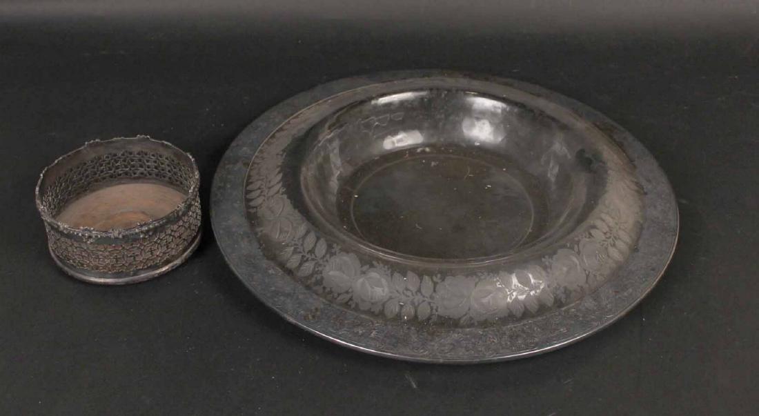 Silver Plated Wine Coaster: Reticulated sides. Together with a silver plated mounted etched glass circular tray. 6"d., 18"d. respectively. By descent from the Estate of Robert Weeks DeForest and Emily Johnston DeForest.