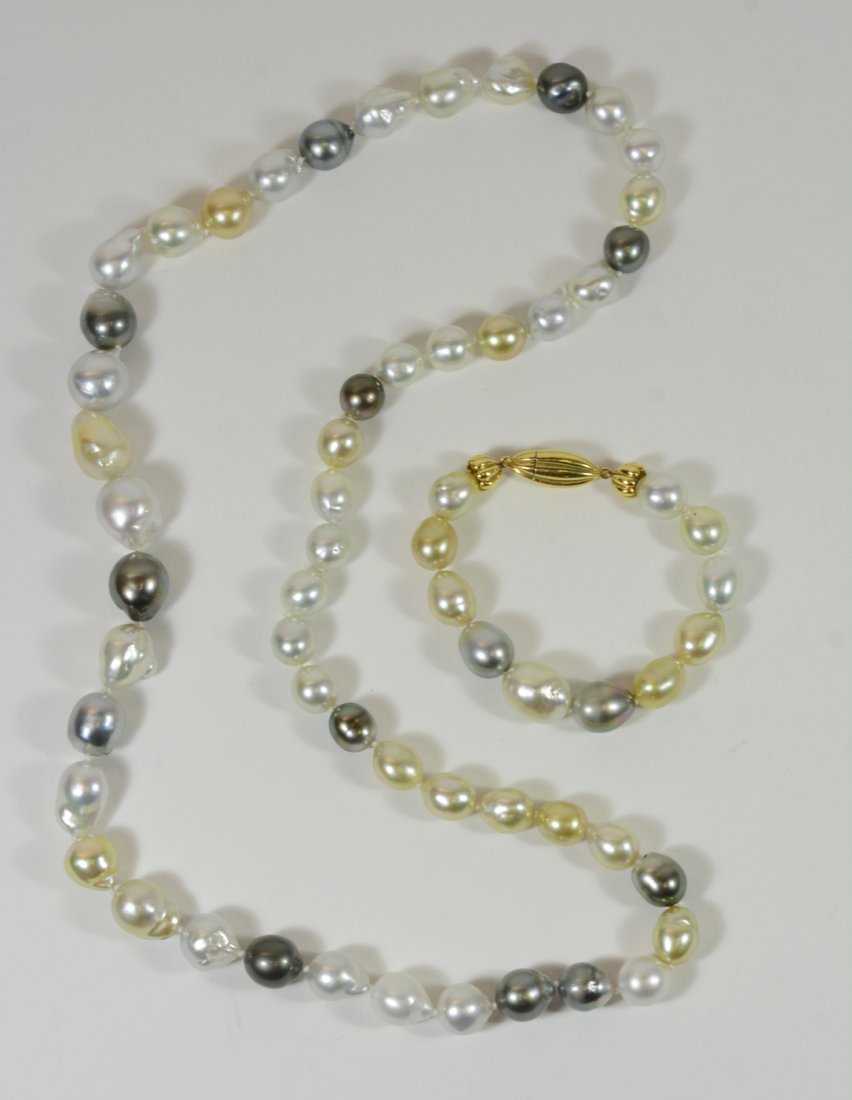 South Sea Baroque & Tahitian Pearl: Necklace and matching bracelet, bracelet with 18K yellow gold clasp, pearls in white, gold and gray, from 10-15MM. Necklace, 28"l, bracelet, 7.75"l. From The Personal Property of Claus & Irma Vollrath