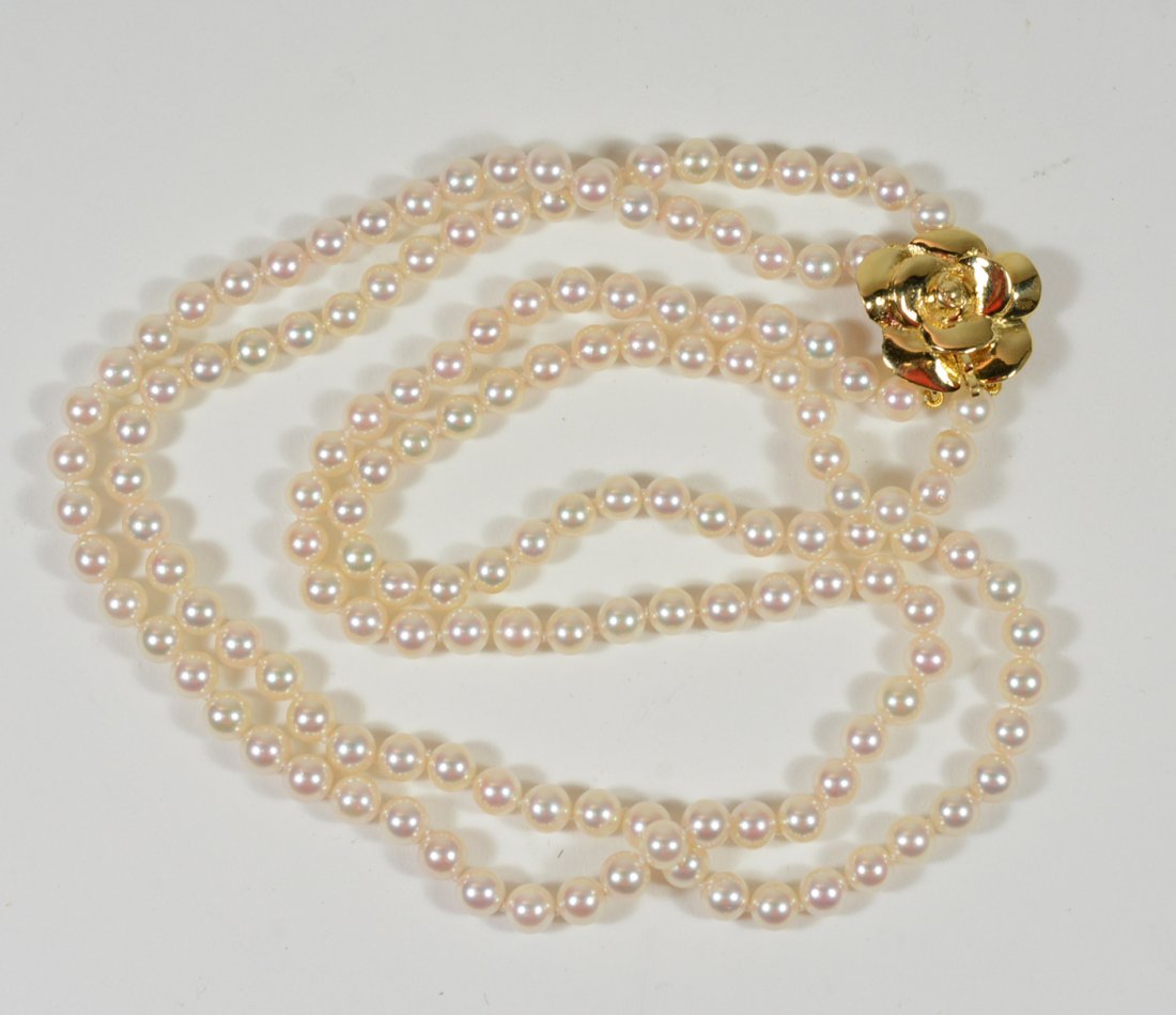 Double Strand 5MM Pearl Necklace: With 18K yellow gold rose form clasp. 16.75"l, 17.5"l. From The Personal Property of Claus & Irma Vollrath.