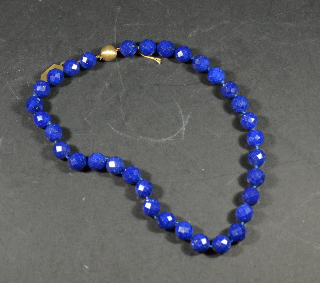 Lapis Lazuli Faceted 12MM Bead Necklace: With 14K yellow gold clasp. 18"l. From The Personal Property of Claus & Irma Vollrath.