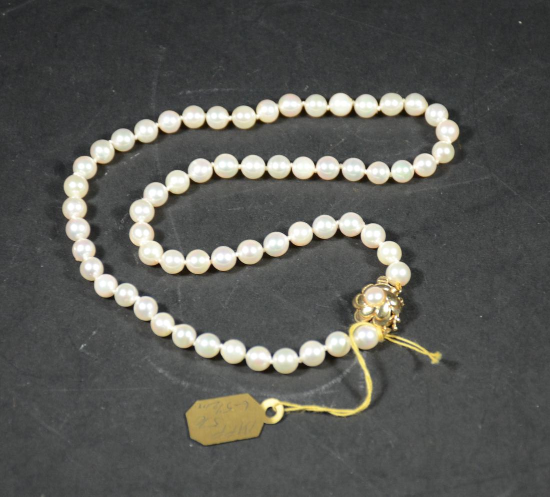 Cultured Pearl Necklace: 5-5-6MM pearls with 14K yellow gold & pearl clasp. 16"l. From The Personal Property of Claus & Irma Vollrath.