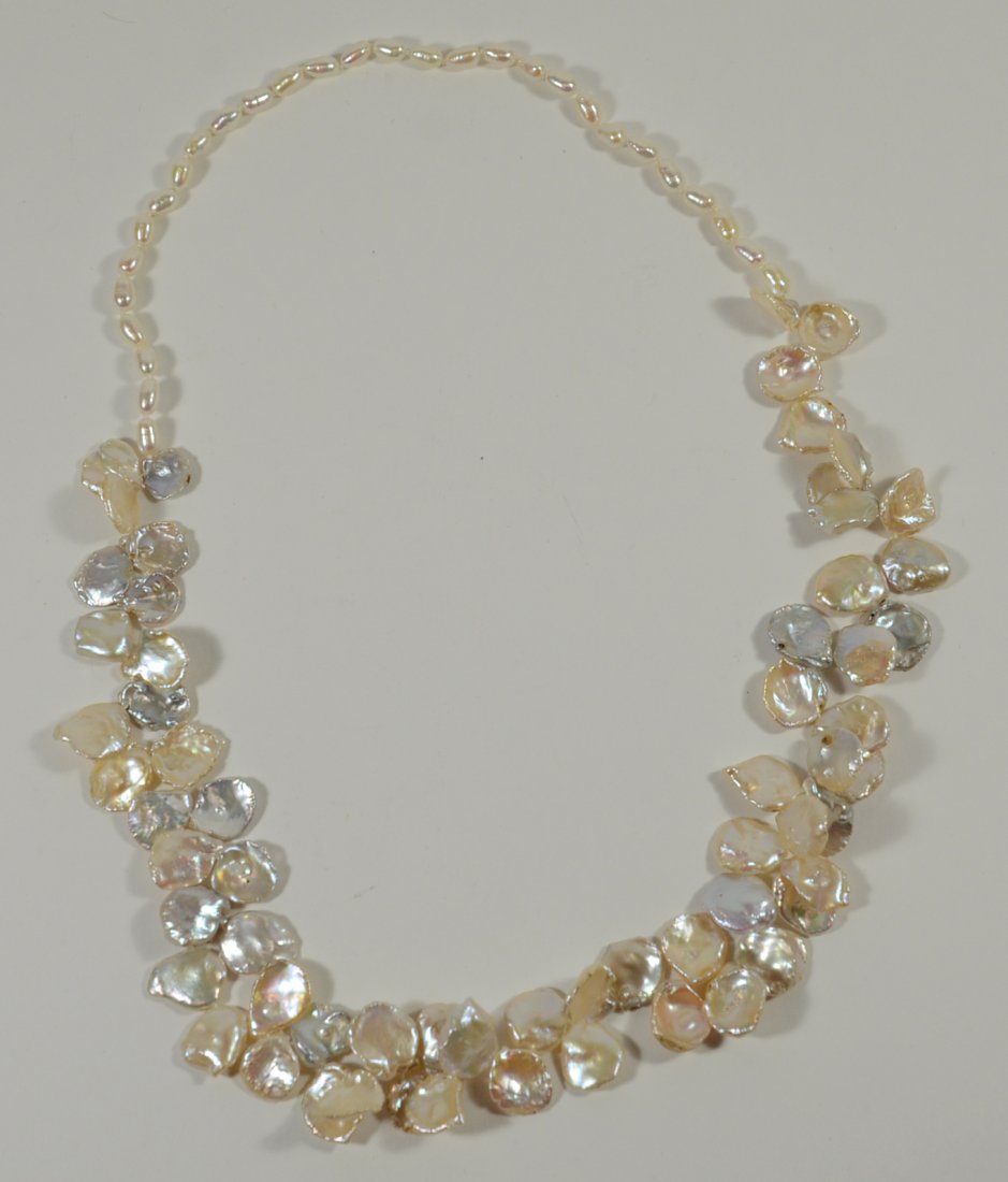 Freshwater Coin & Rice Pearl Necklace: 25"l. From The Personal Property of Claus & Irma Vollrath.