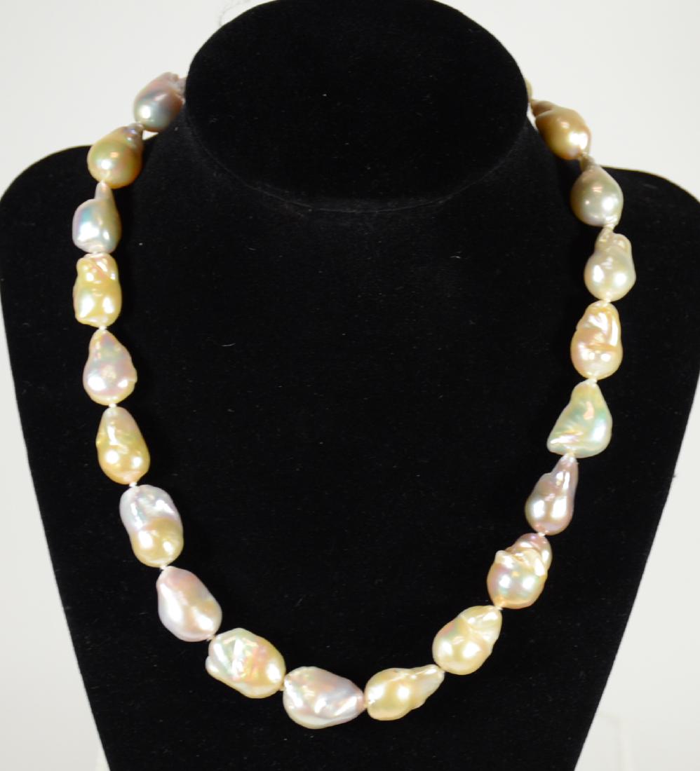 Freshwater Baroque Pearl Necklace: With 14K yellow and white gold clasp. 17.5"l. From Claus Vollrath Inc., Mt. Kisco, New York.
