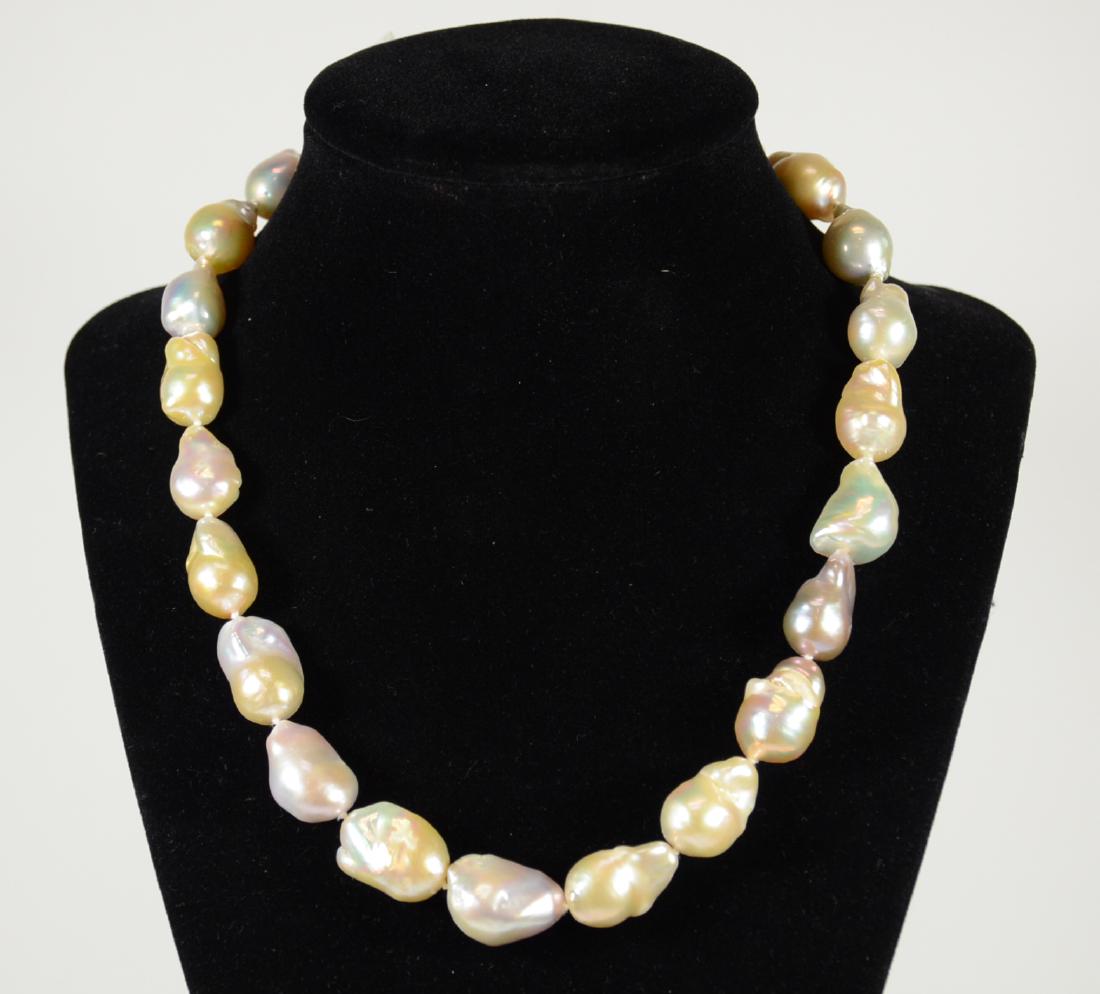 White Baroque Freshwater Pearl Necklace: With 14K white gold clasp. 17.5"l. From Claus Vollrath Inc., Mt. Kisco, New York.