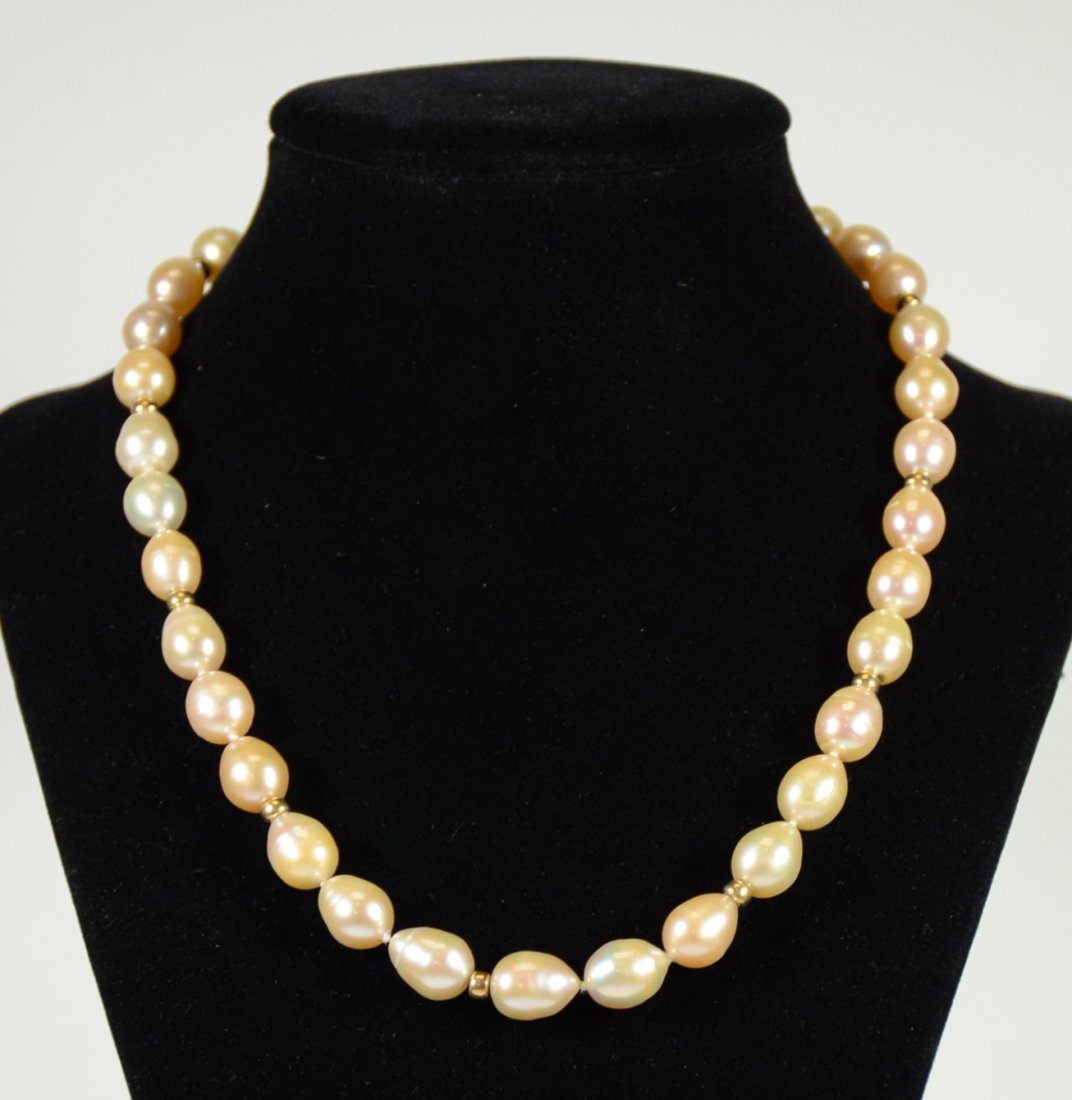 Peach Freshwater Pearl Gold Rondel: Necklace, 8-10MM drop form pearls, 14K yellow gold rondels and clasp. 17.5"l From Claus Vollrath Inc., Mt. Kisco, New York.