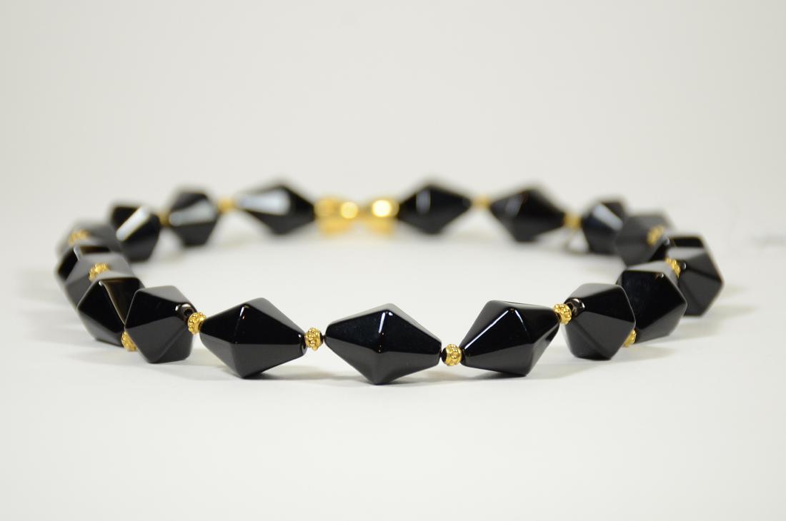 18K Yellow Gold Black Onyx Necklace: 19.5"l. From Claus Vollrath Inc., Mt Kisco, New York.