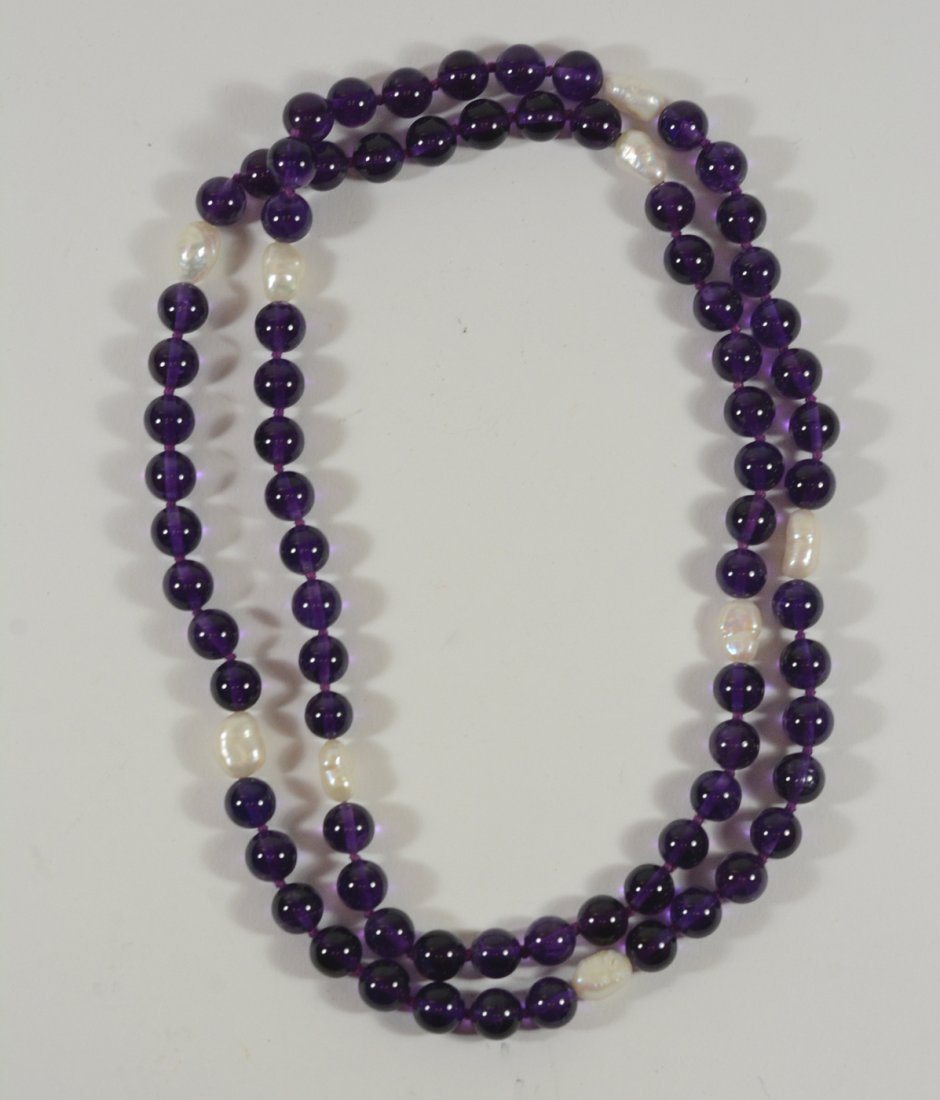 Amethyst Beaded Freshwater Baroque: Pearl Necklace. 32"l. From Claus Vollrath Inc., Mt Kisco, New York.