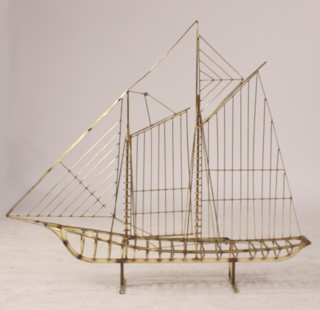 Brass Model of Sail Boat: Bears date and partially legible signature on bowsprit, "O C Jeve/ 1976." Of impressive size. 41"h x 47"l