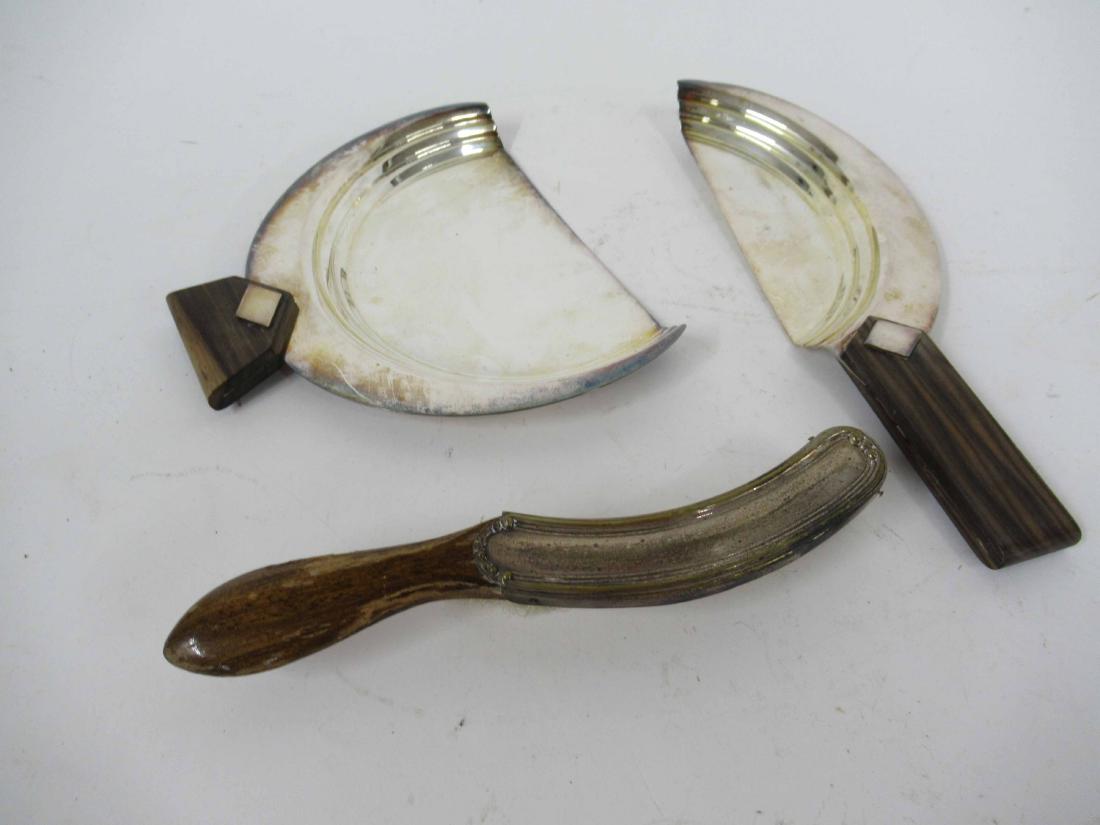 Two Modern Christofle crumbers: Together with a brush. largest 8 1/4" x 7"