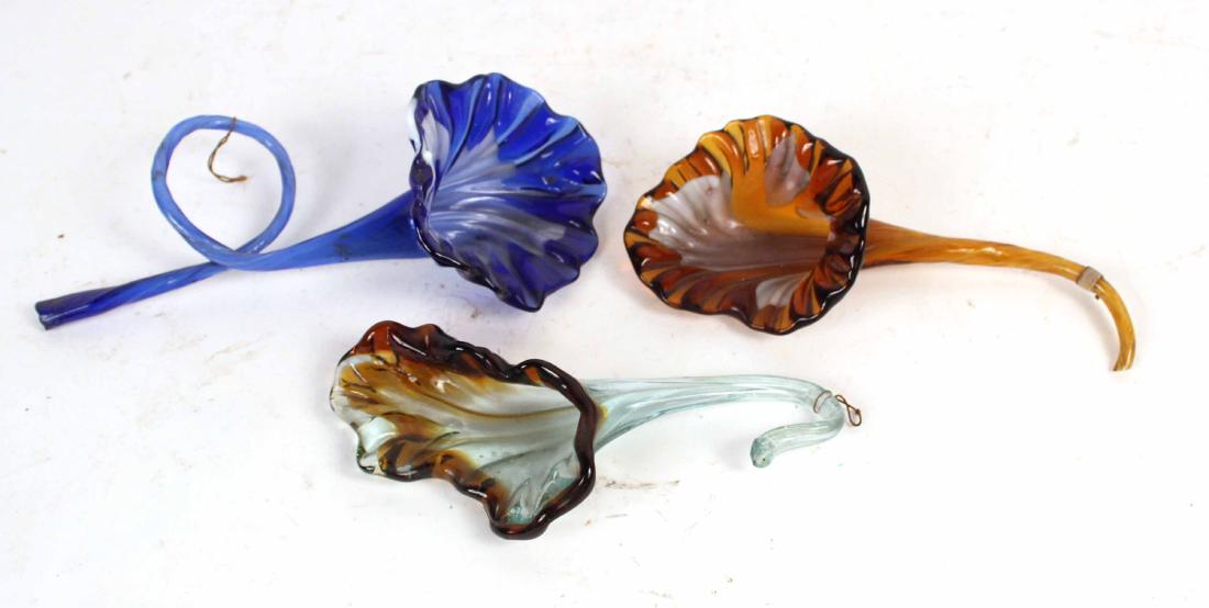 Three Art Glass Flowers: 11"l By descent from the Estate of Robert Weeks DeForest and Emily Johnston DeForest.