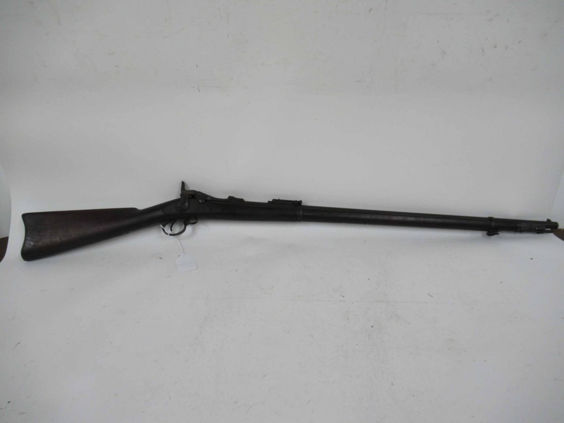 Springfield Trap Door Carbine Short Rifle: Mode 1873, serial #520858. Together with a flintlock dueling pistol. Pistol: 14"l overall. Barrel: 32-1/2"l