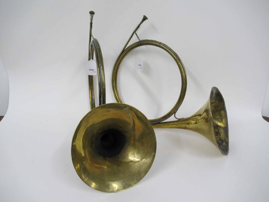 Two Brass French Horns: 19th/20th C., one marked "Royer Jne A Paris," the other marked "Brevete." Apx. 20"h x 27"w