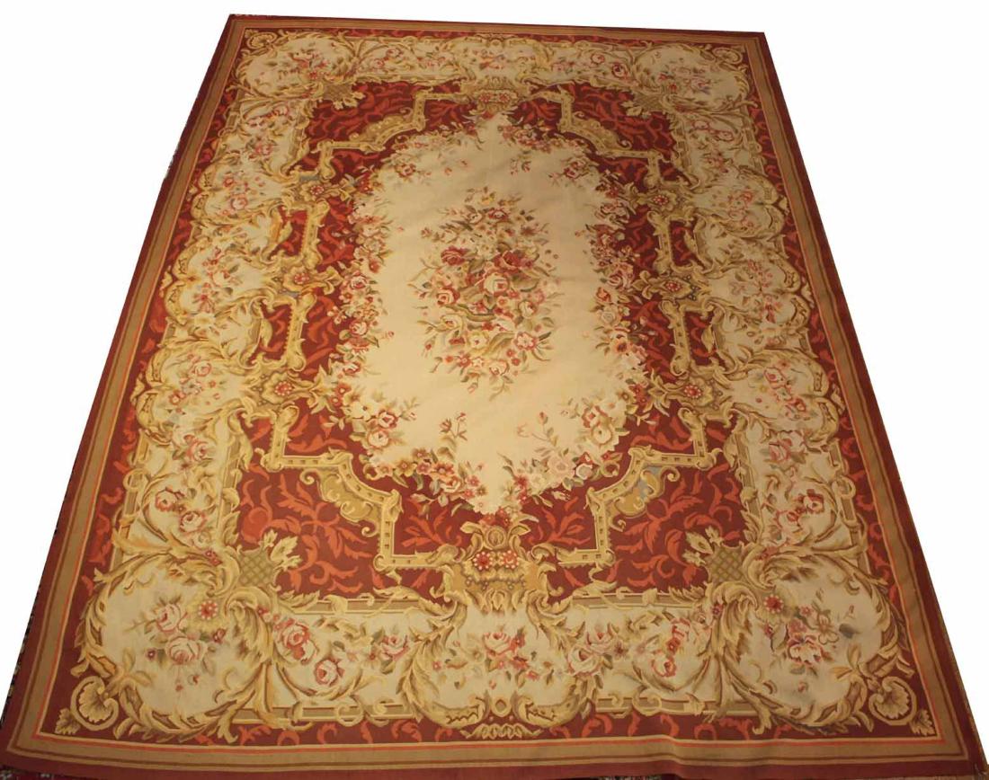 Aubusson Style Carpet: 20th C., with repeating floral sprays, worked in tones of pink, green, and ivory. 12'l x 8'8"w
