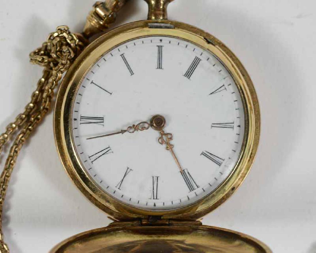 14K Yellow Gold Ladies Hunter Case: Pocket watch, engraved case "Remontoir". Together with a gold filled watch chain. 1-1/4"d.