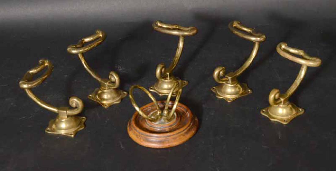 Five Brass Tiebacks: Together with a wood mounted brass double ring, monogrammed M.S.J.F tieback 4"d