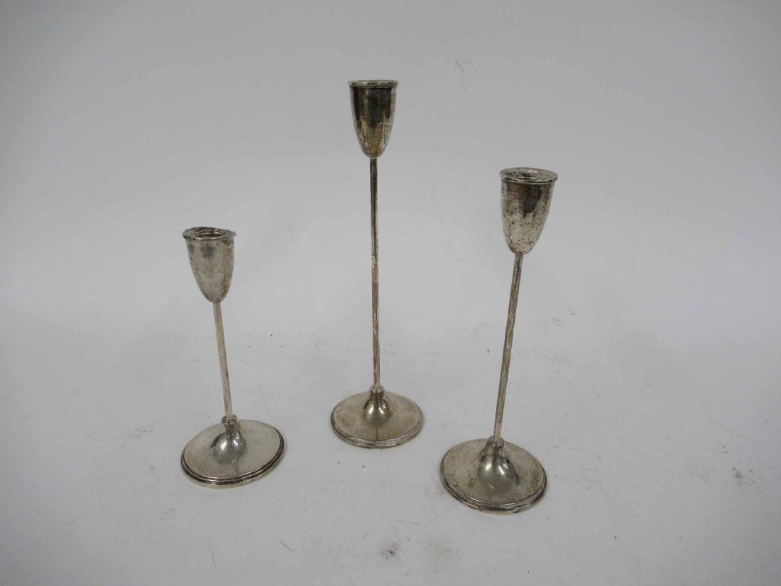Three Graduated Sterling Silver Candle Sticks: Marked Empire Sterling weighted candle sticks. together with a Gorham pierced silver lampshade. largest 12" tall x 3 1/2" dia at base